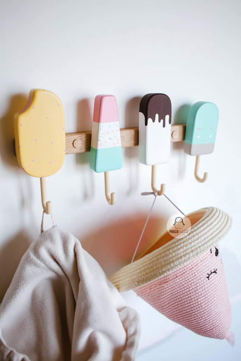Clothes and towel hanger for nursery with wooden ice cream hooks