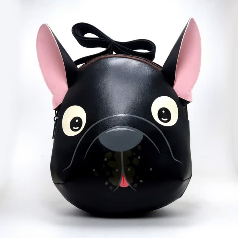Black french bulldog crossbody bag is compact fro carrying mobile phones.