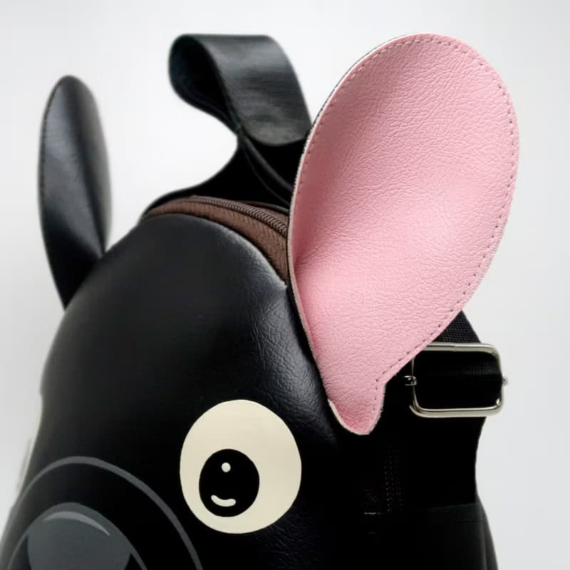 Black french bulldog crossbody bag is compact fro carrying mobile phones.