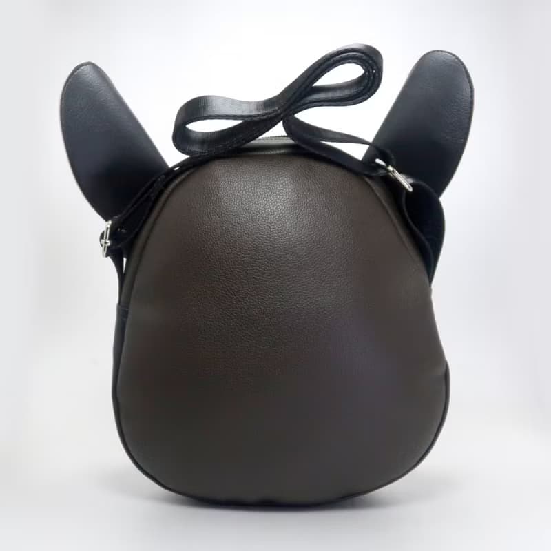 Black french bulldog crossbody bag is compact fro carrying mobile phones.