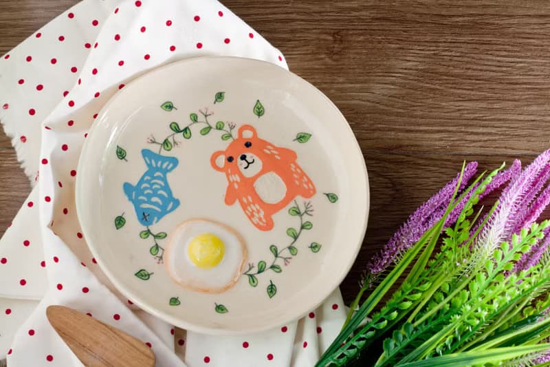 Plate with bear, egg, fish pattern