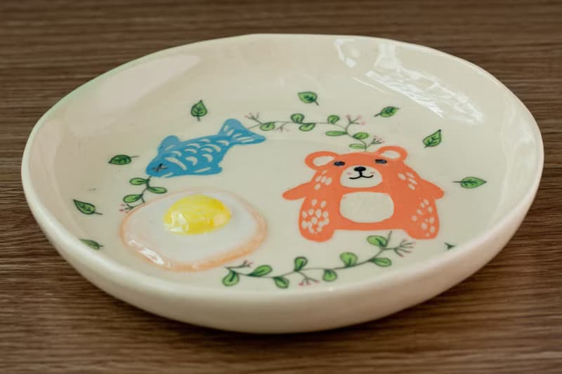 Plate with bear, egg, fish pattern