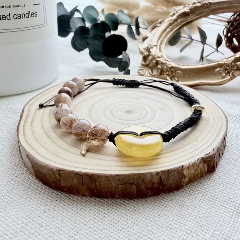 焰語之環手鍊・蜜蠟平安扣 × 銅髮晶 × 黑玉線編織羽葉原創設計