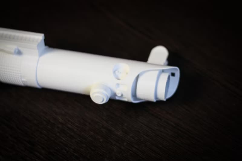 White wedding bouquet holder inspired by Luke's lightsaber hilt