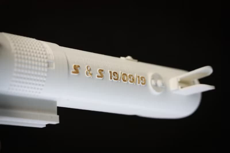 White wedding bouquet holder inspired by Luke's lightsaber hilt