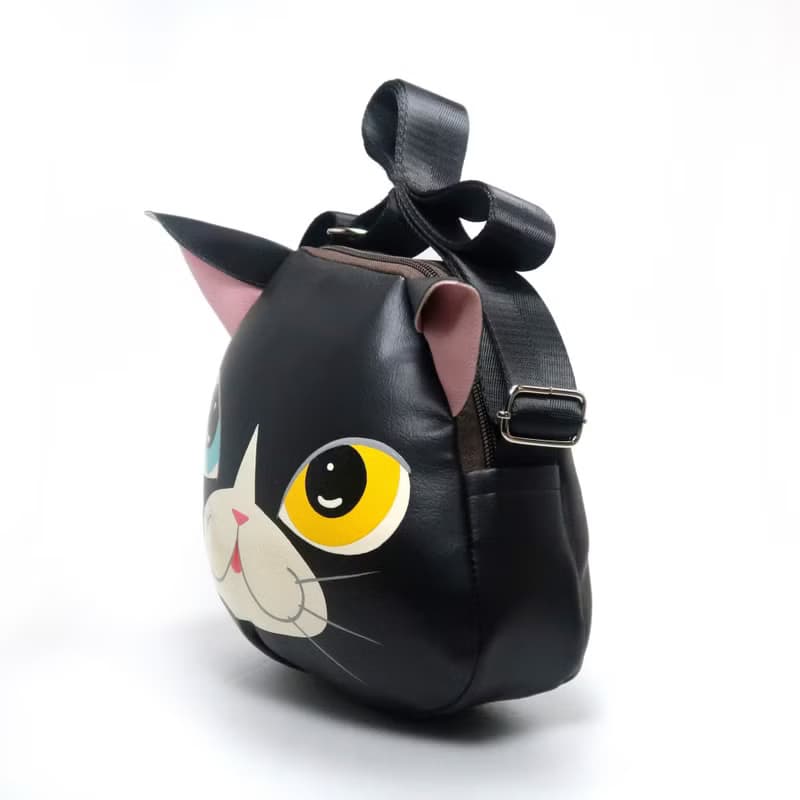 Black cat crossbody bag is compact fro carrying mobile phones.