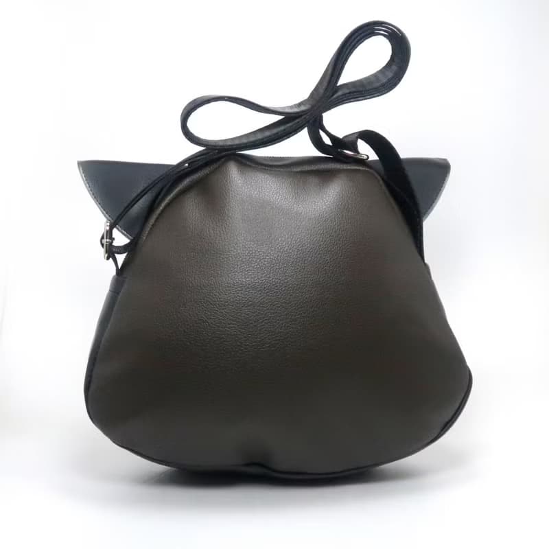 Black cat crossbody bag is compact fro carrying mobile phones.