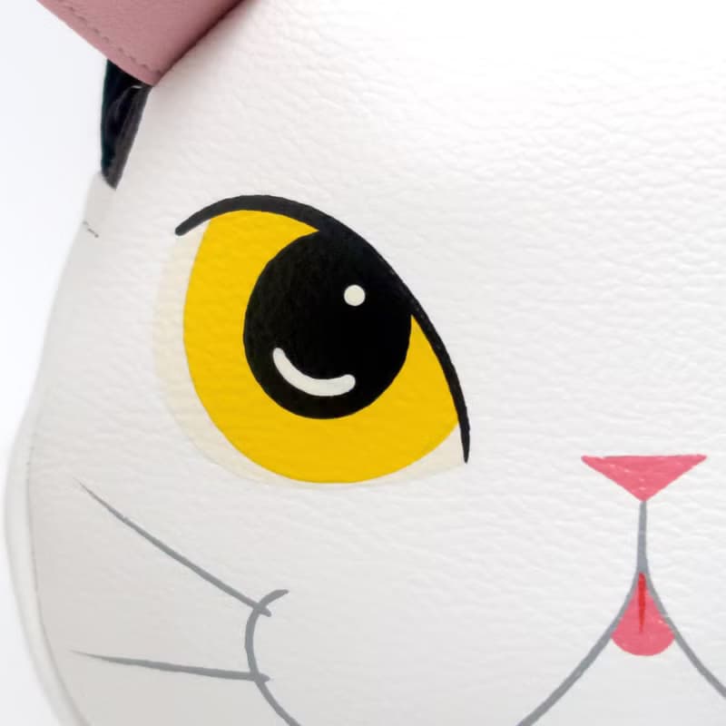 White cat crossbody bag is compact fro carrying mobile phones.
