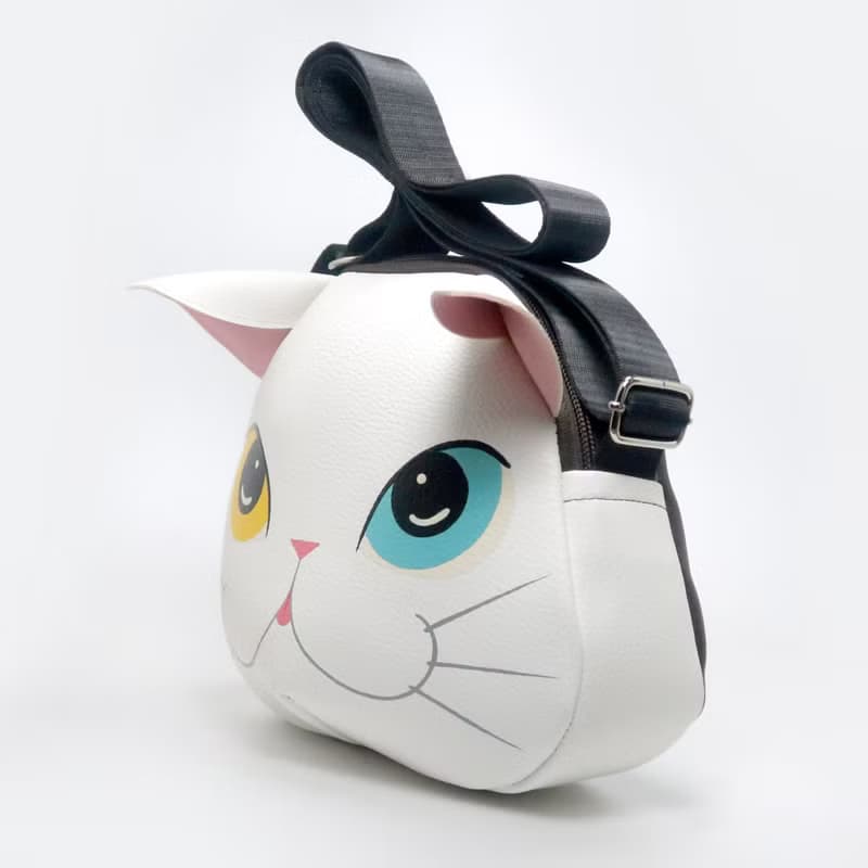 White cat crossbody bag is compact fro carrying mobile phones.