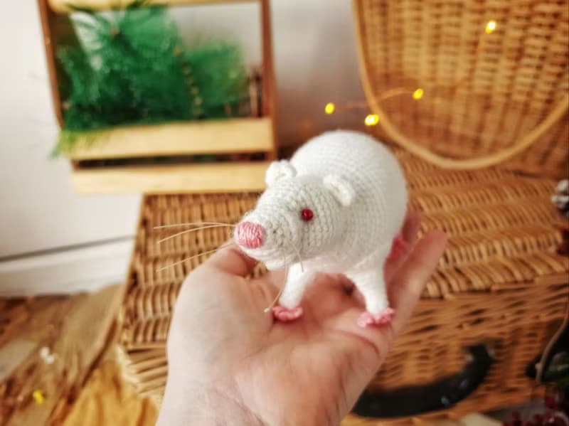 Soft toy life-size white rat with red eyes. White mouse toy.