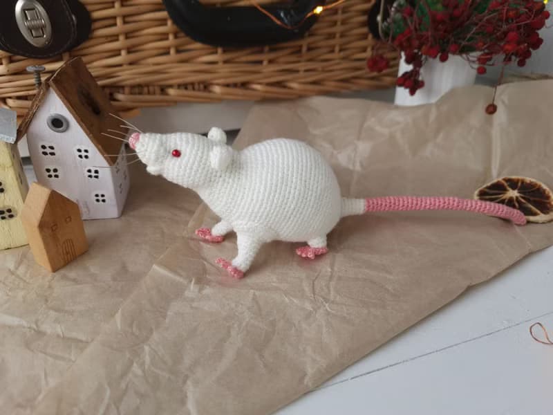 Soft toy life-size white rat with red eyes. White mouse toy.