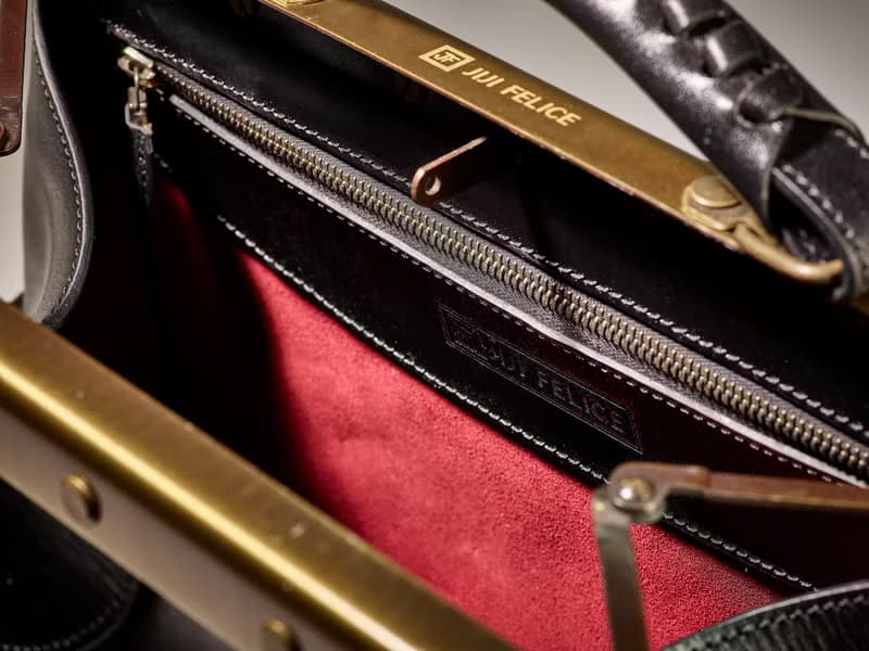 Black vegetable-tanned leather old frame western bag.