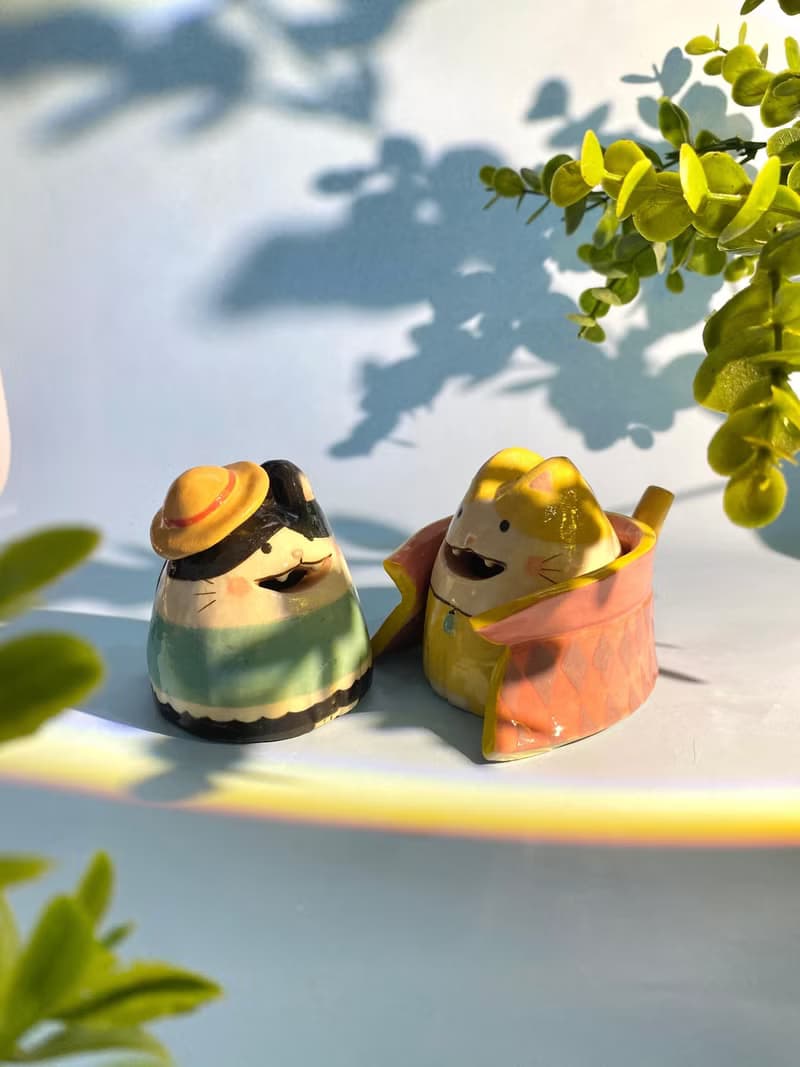 Cute handmade ceramic dolls for home decoration.