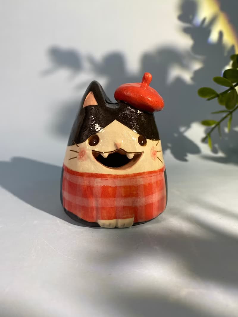 Cute handmade ceramic dolls for home decoration.