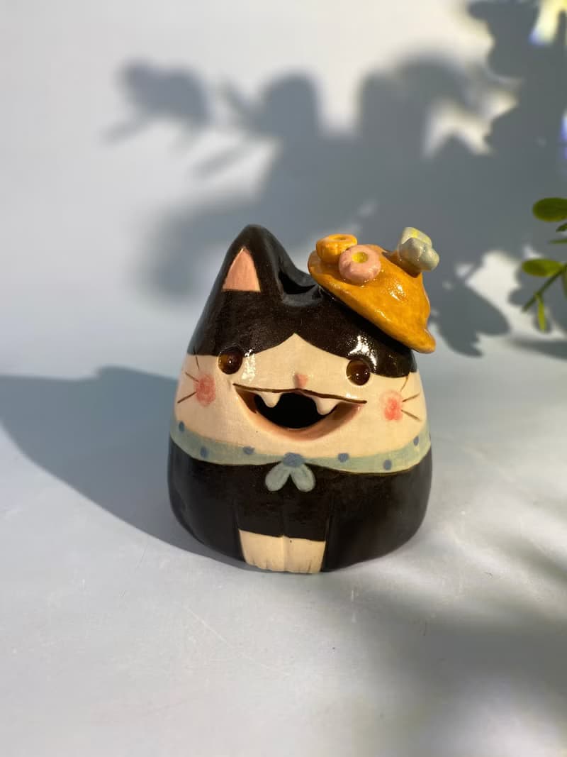 Cute handmade ceramic dolls for home decoration.