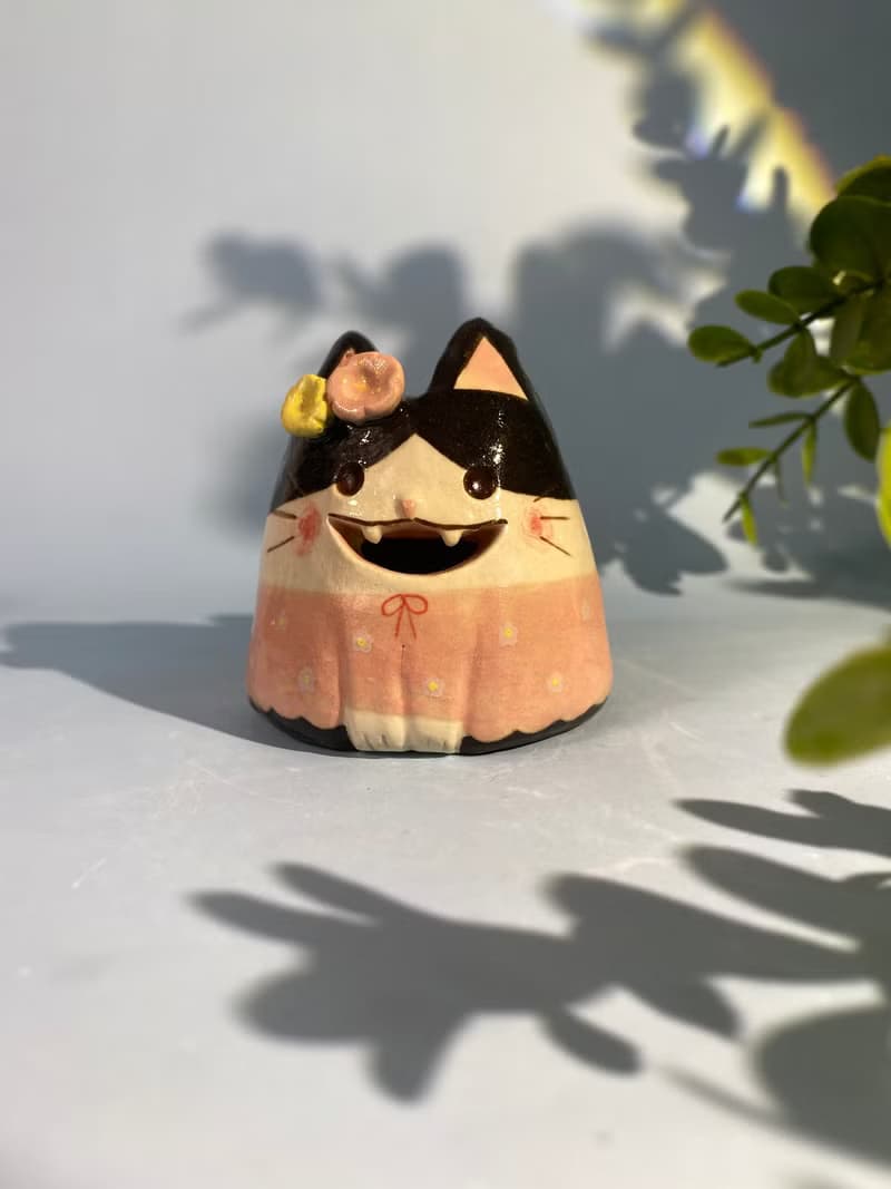 Cute handmade ceramic dolls for home decoration.