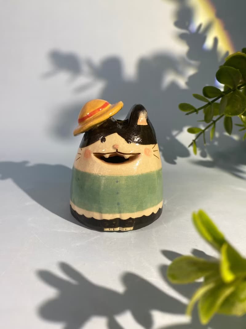 Cute handmade ceramic dolls for home decoration.