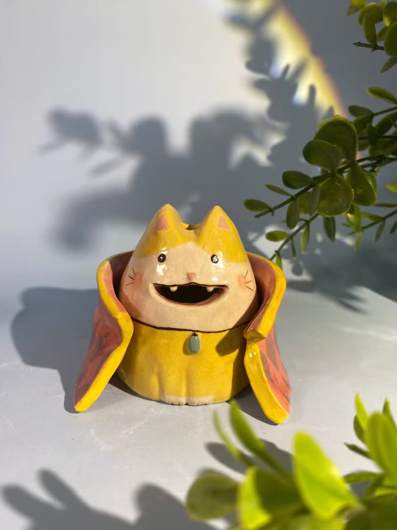 Cute handmade ceramic dolls for home decoration.