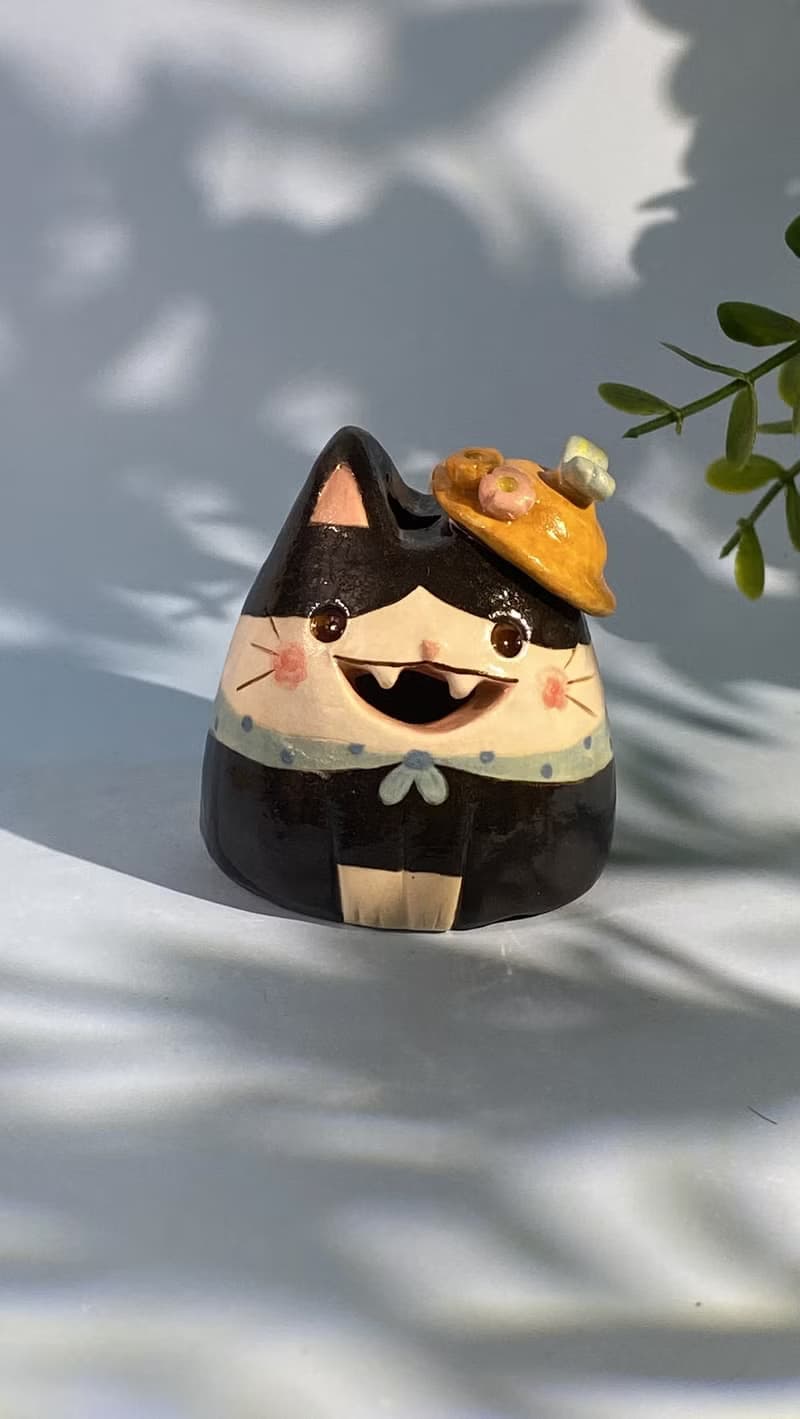 Cute handmade ceramic dolls for home decoration.