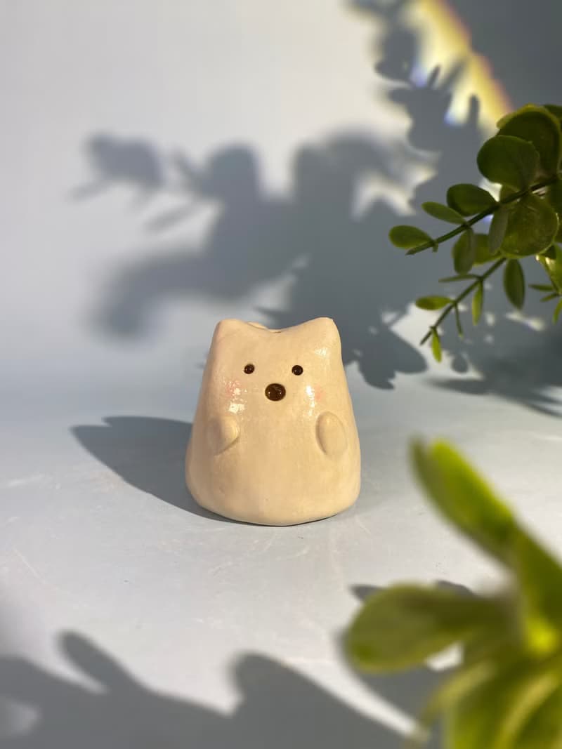 Cute handmade ceramic dolls for home decoration.