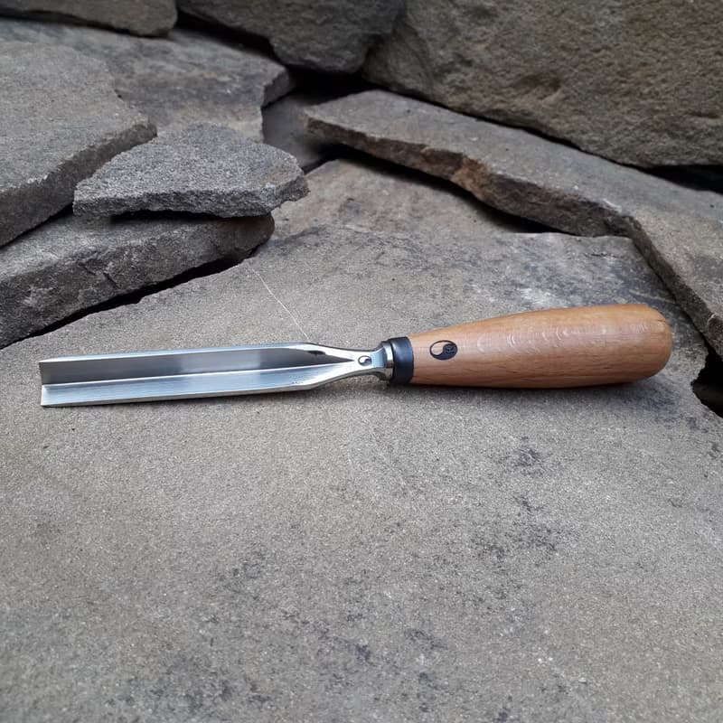 Forged  V-chisel. Woodworking tool. Woodcarving chisel.