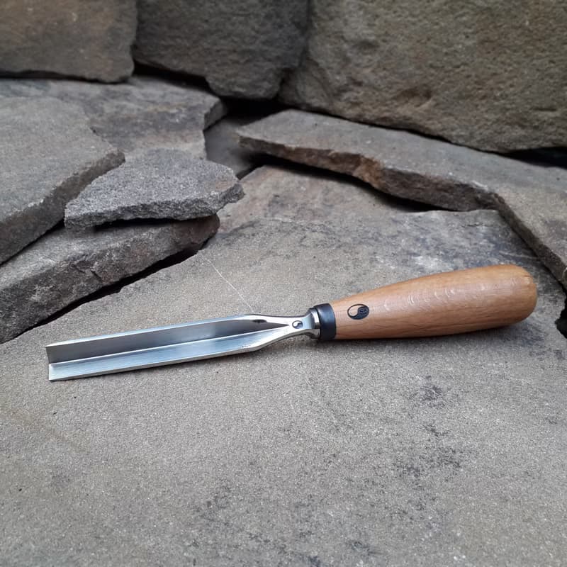Forged  V-chisel. Woodworking tool. Woodcarving chisel.
