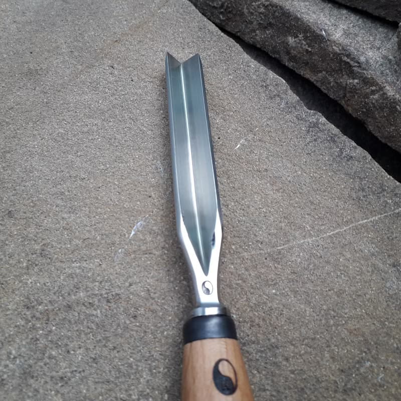 Forged  V-chisel. Woodworking tool. Woodcarving chisel.