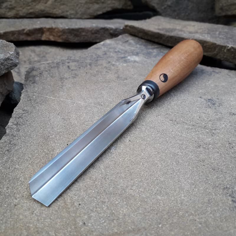 Forged  V-chisel. Woodworking tool. Woodcarving chisel.