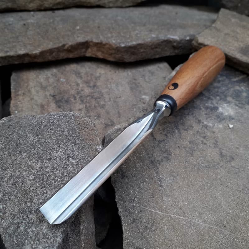 Forged  V-chisel. Woodworking tool. Woodcarving chisel.