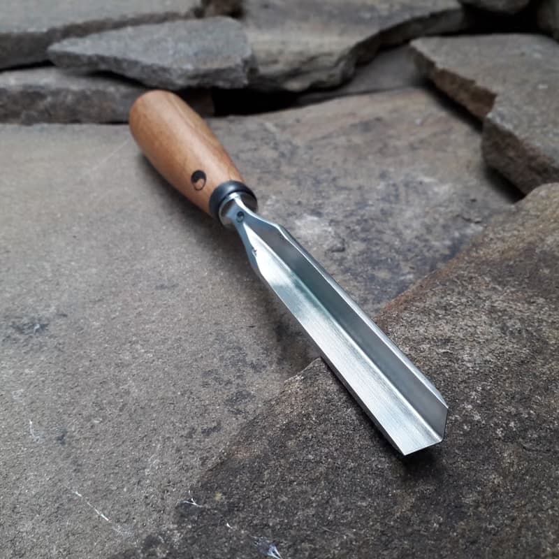 Forged  V-chisel. Woodworking tool. Woodcarving chisel.