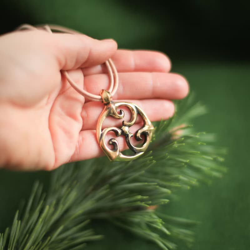 Triskele pendant on leather cord. Triskelion necklace. Celtic jewelry. Pagan Art