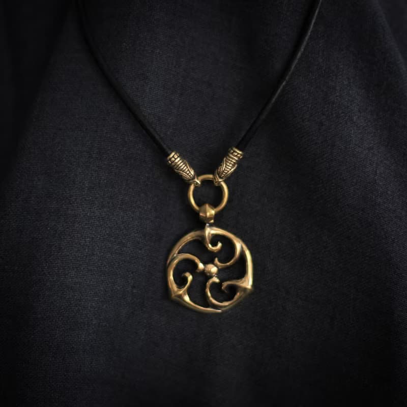 Triskele pendant on leather cord. Triskelion necklace. Celtic jewelry. Pagan Art