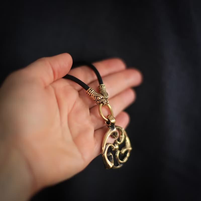 Triskele pendant on leather cord. Triskelion necklace. Celtic jewelry. Pagan Art