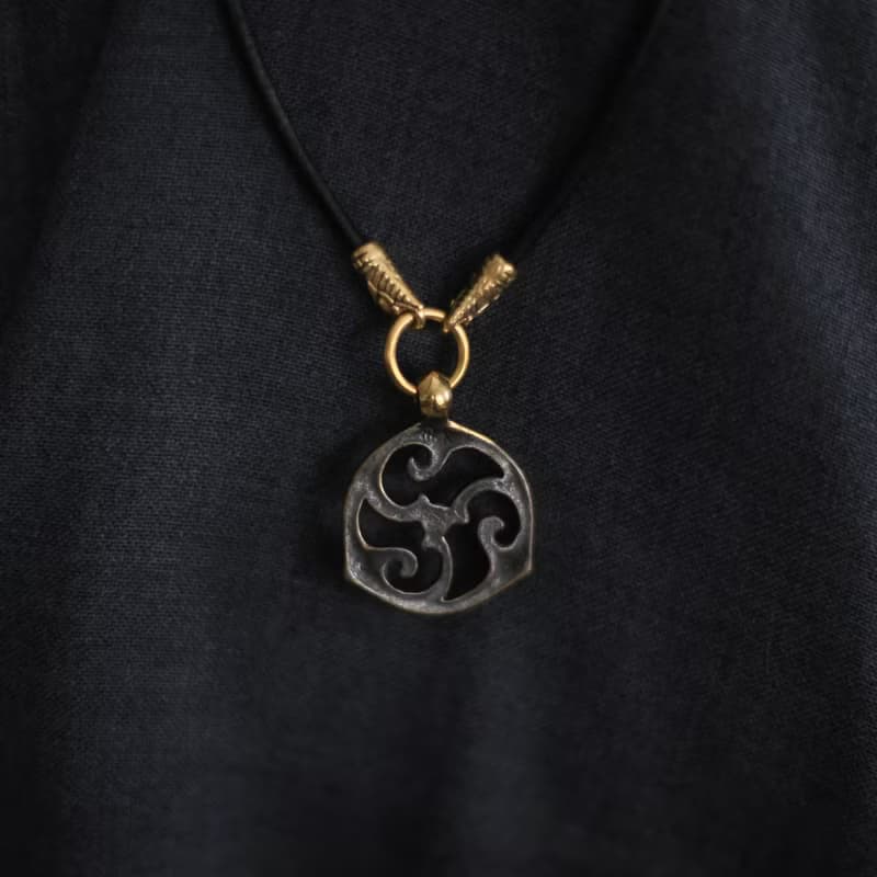 Triskele pendant on leather cord. Triskelion necklace. Celtic jewelry. Pagan Art