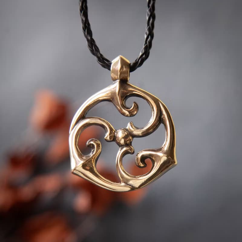 Triskele pendant on leather cord. Triskelion necklace. Celtic jewelry. Pagan Art
