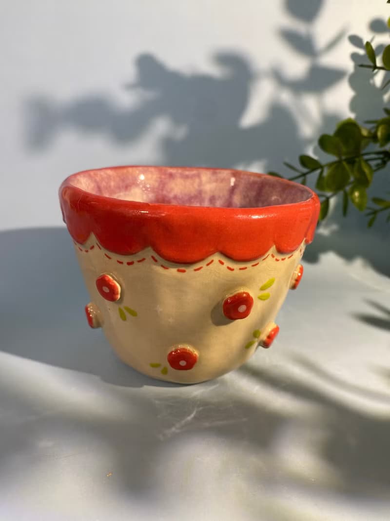 Handmade ceramic cup. Handmade ceramic mug with cute flower lover pattern for gifts.