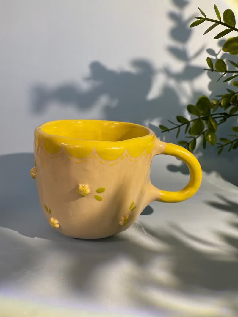 Handmade ceramic cup. Handmade ceramic mug with cute flower lover pattern for gifts.