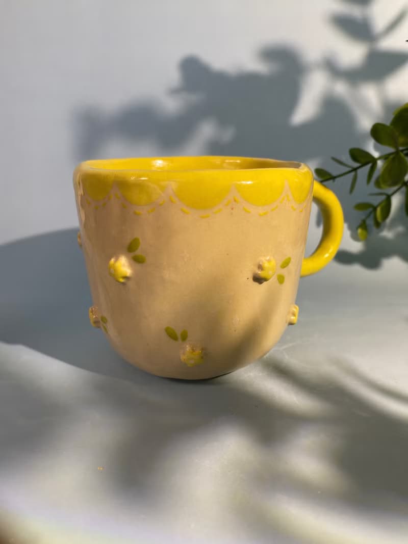 Handmade ceramic cup. Handmade ceramic mug with cute flower lover pattern for gifts.
