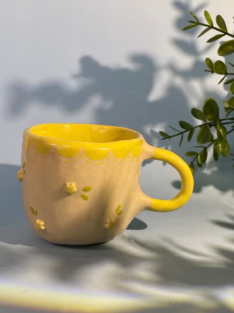 Handmade ceramic cup. Handmade ceramic mug with cute flower lover pattern for gifts.