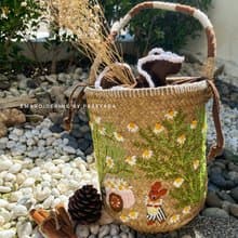 Thai woven rattan bag with hand-embroidered daisy and rabbit pattern