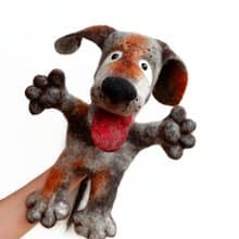 A dog with brown spots, puppet,  glove puppet, felted toy made of wool.