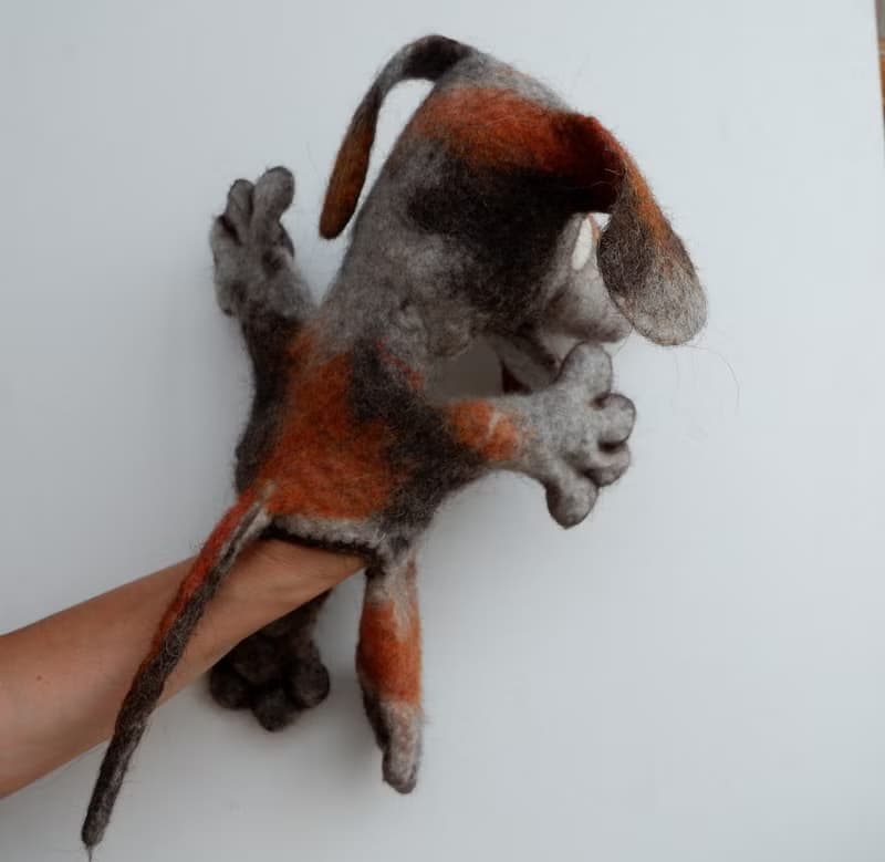 A dog with brown spots, puppet,  glove puppet, felted toy made of wool.