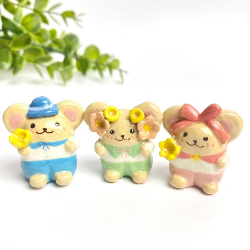Cute handmade ceramic mice in various designs.