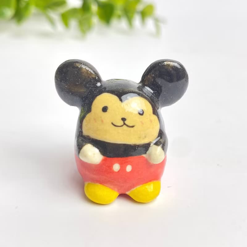 Cute handmade ceramic mice in various designs.