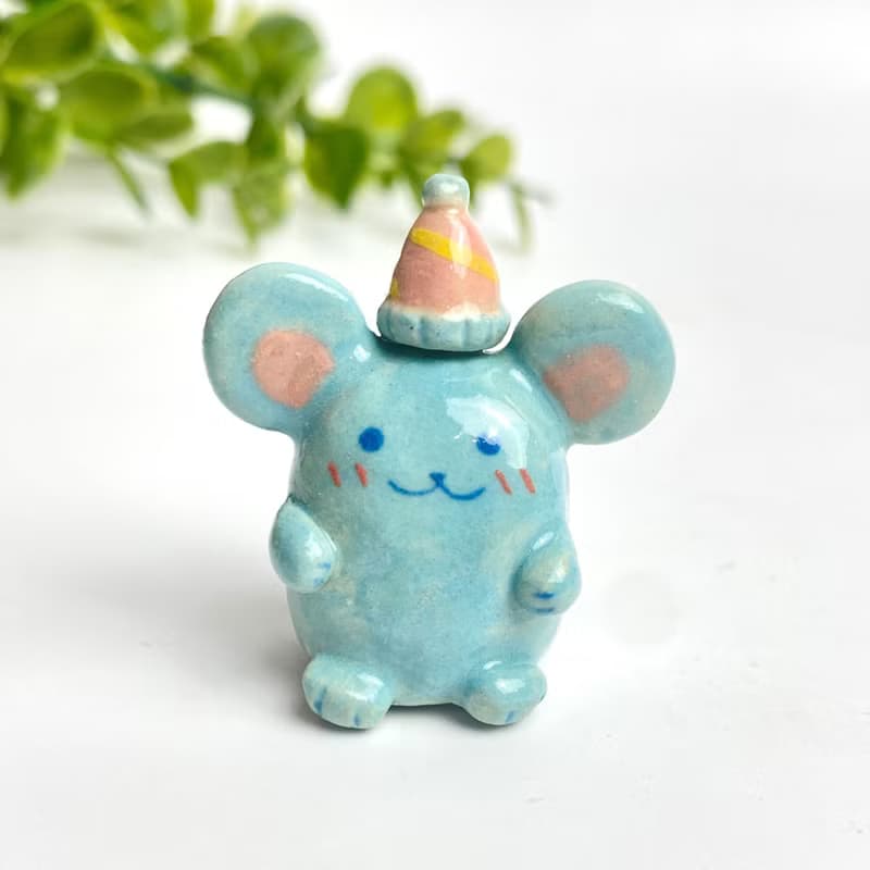 Cute handmade ceramic mice in various designs.