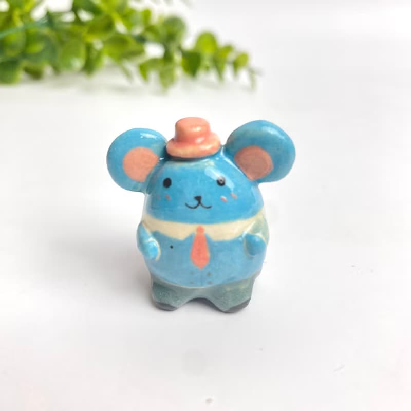 Cute handmade ceramic mice in various designs.