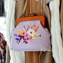 Handmade shoulder bag with cross stitched Boho bouquet, wooden clasp, crossbody
