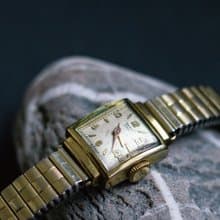 RENTSCH ZURICH 立體弧形鏡面金色方形 手動上鍊機械錶彈性錶帶