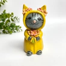 Handmade ceramic doll vase with a cute yellow cat and flower lover.
