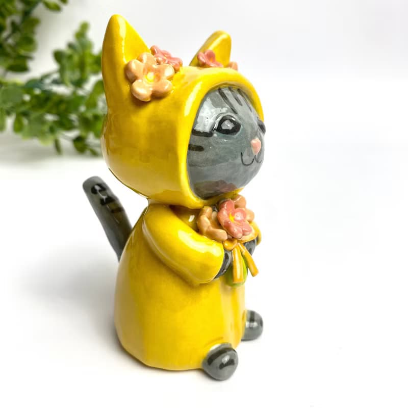 Handmade ceramic doll vase with a cute yellow cat and flower lover.